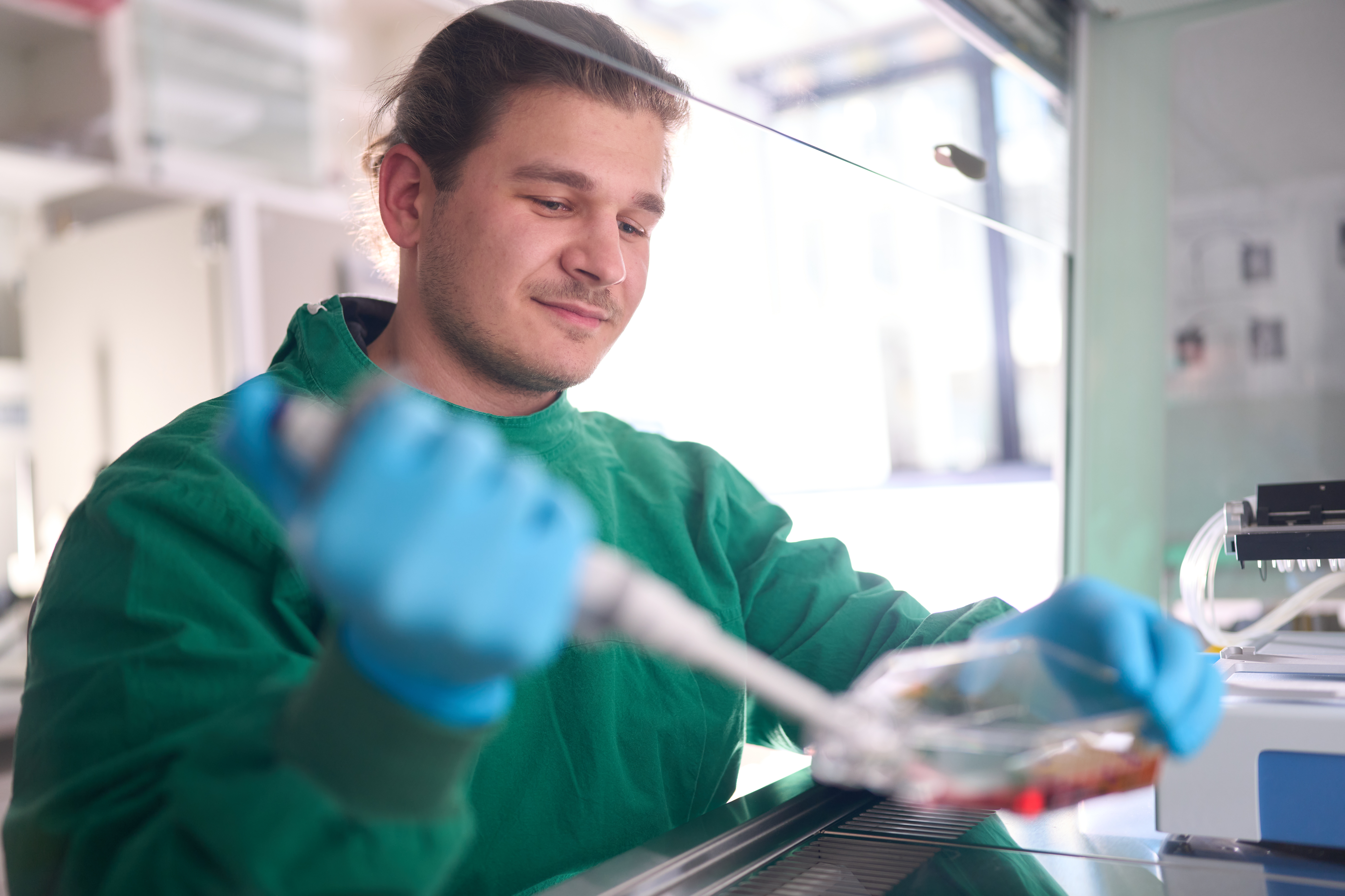 Researcher pipetting in the lab